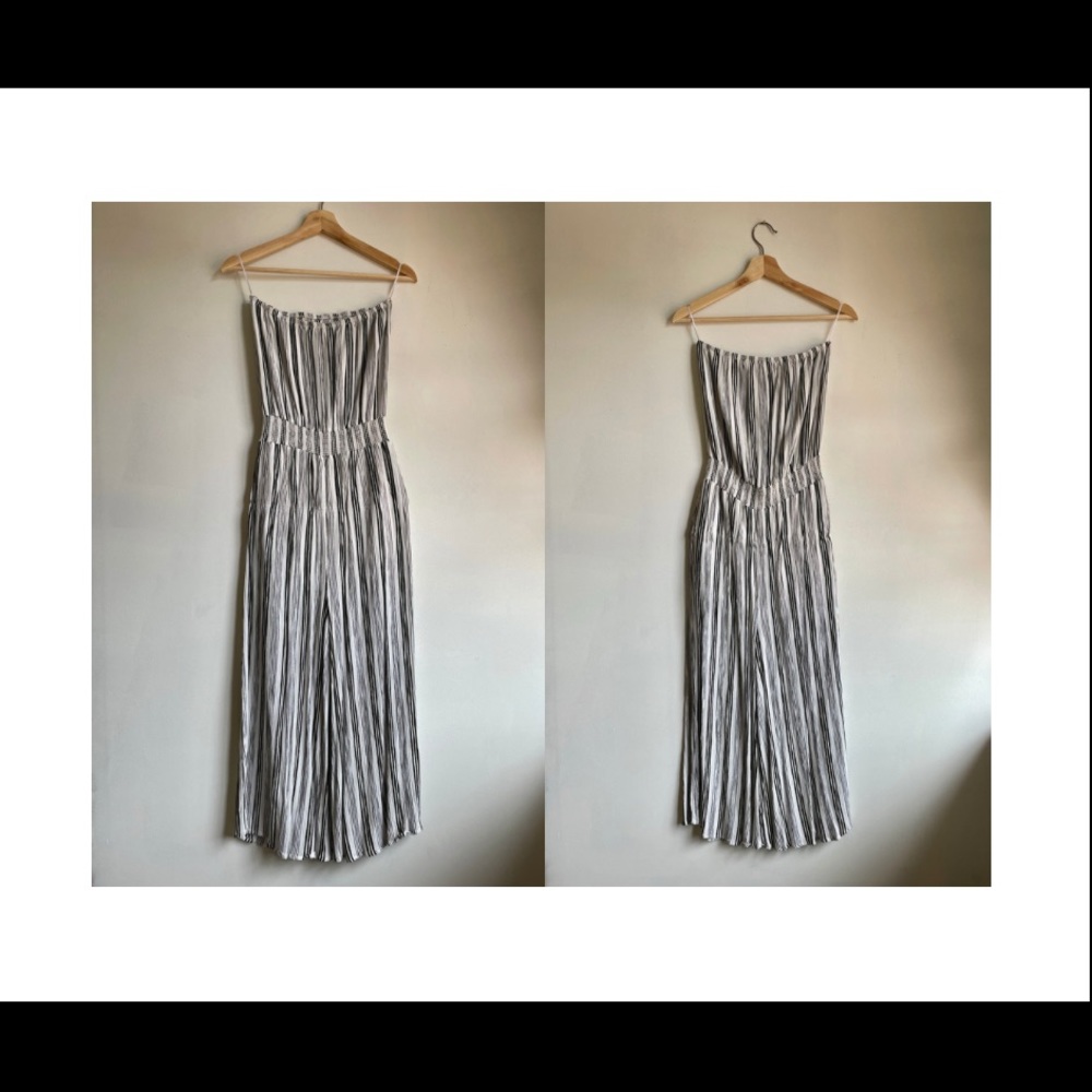Strapless, vertical striped black and white romper with flowy pant legs